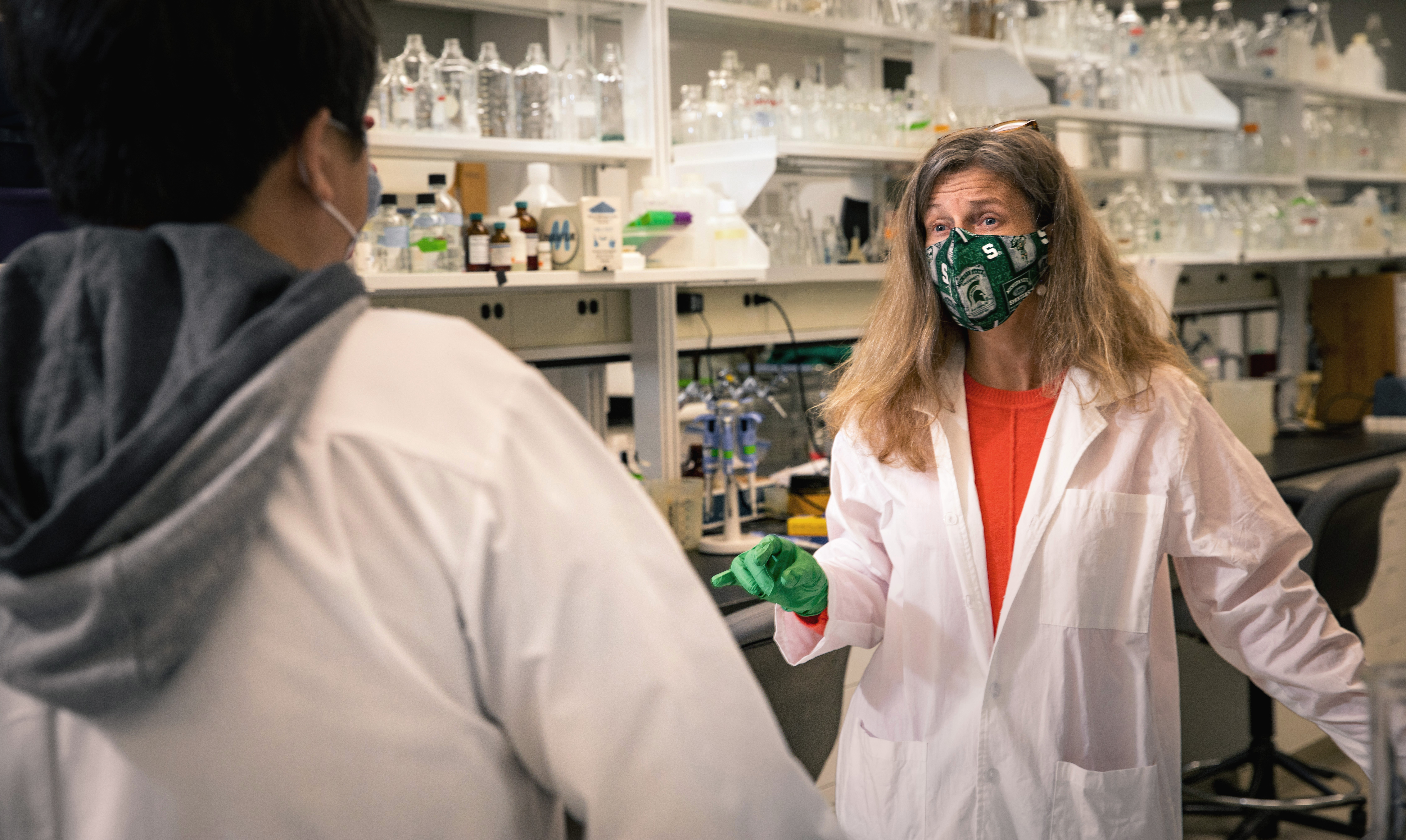 McCabe in her lab with another person